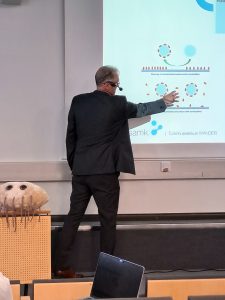 Research Manager Martti Latva presents in front of an audience.