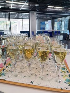 A row of sparkling wine glasses.